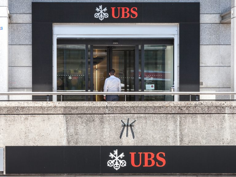 The entrance to a UBS bank branch, displaying the bank's distinctive logo.